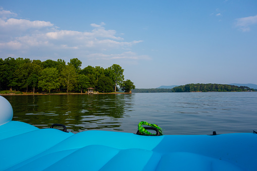 Relaxing views while floating on Smith Mountain Lake in Virginia on a beautiful summer day.