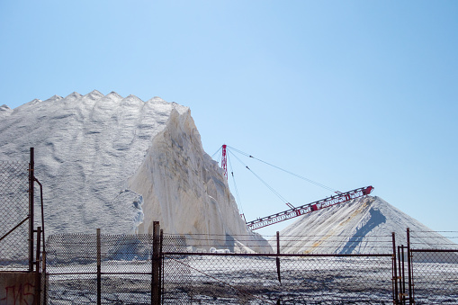 Large piles of what looks to be salt at an industrial factory in California.