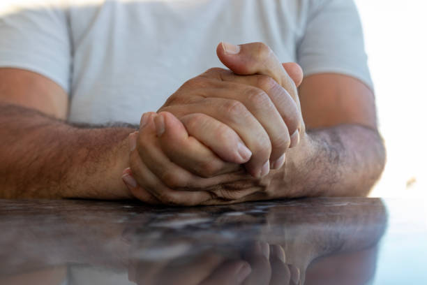 istock close-up male hands with emotional expressions. 1556385267