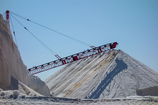 Large piles of what looks to be salt at an industrial factory in California.