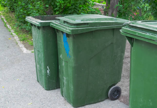 istock Green plastic trash recycling containers. Green containers for collecting garbage on the dustbin. 1556390442