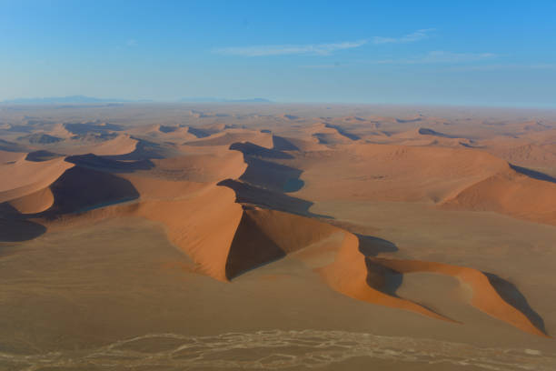 Aerial view of Sossusvlei Aerial view of Sossusvlei, Namibia, from the helicopter in the early morning namib sand sea stock pictures, royalty-free photos & images