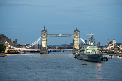 HMS Belfast warship and Tower Bridge in Thames River in London