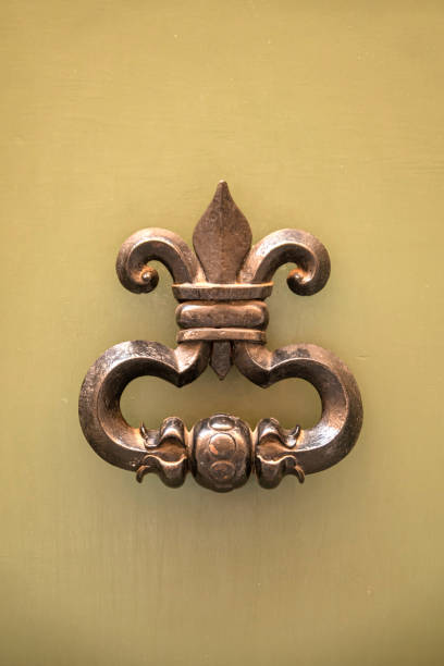 istock Vintage metal doorknob knocker gong 1556438528