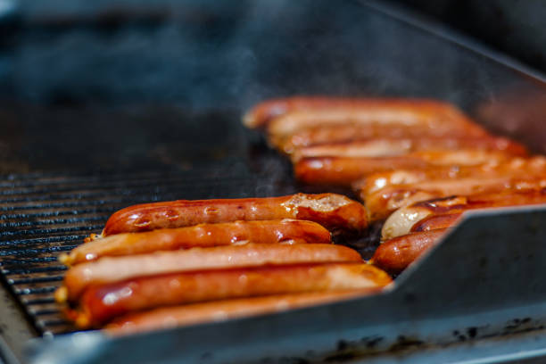 istock Sausages on Flat Top Grill Outdoors 1556460007
