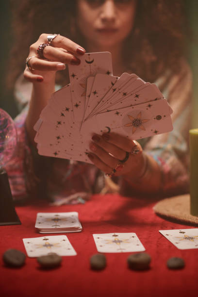 istock Woman Reading Tarot Cards 1556503489