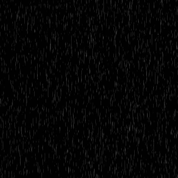istock Heavy rain wall falling in front of the camera against black screen. Raindrops splashing. Rain closeup vfx insert. Practical seamlessly loopable footage. Heavy rainstorm hitting black surface. 1556504050