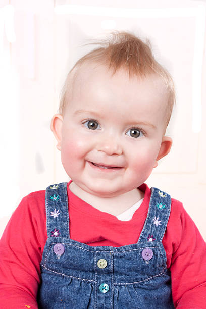 istock One year old baby girl smiling at the camera 155652047