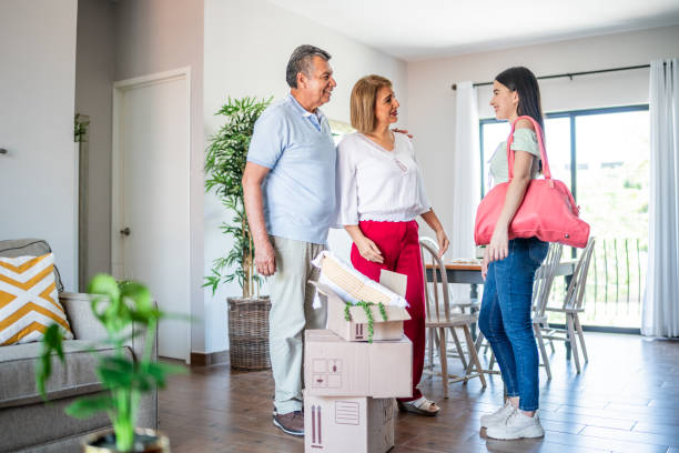 istock Young woman leaving parent's house 1556525974
