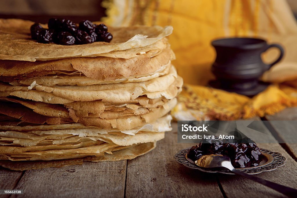 Crepes on the wooden table with cherry Baked Stock Photo