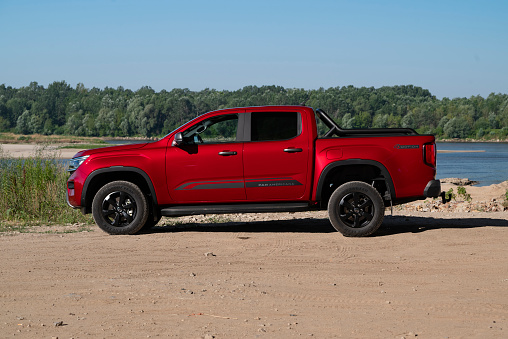 Nantwich, Cheshire, England, July 26th 2023. Red Ram 1500 pickup truck at a trade show stand, automotive lifestyle editorial illustration.