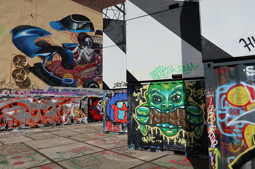 Graffiti art on walls and sea containers at the NDSM wharf in Amsterdam North, Netherlands