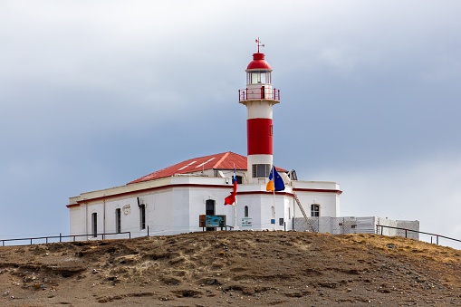 Faro Isla Magdalena, Maritime Signalling Lighthouse at Famous Penguin Reserve National Monument on Magdalena Island in Strait of Magellan off Punta Arenas Patagonia Coast, Chile