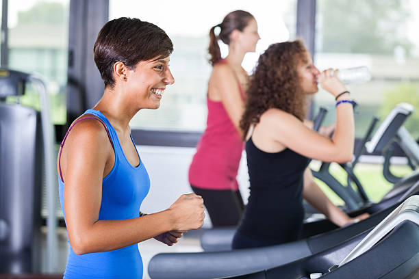 istock People Running on Treadmill in the Gym 155660878