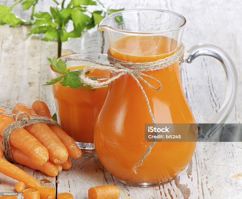 Healthy food - carrots and juice Healthy food - carrots and carrots juice Carrot Stock Photo