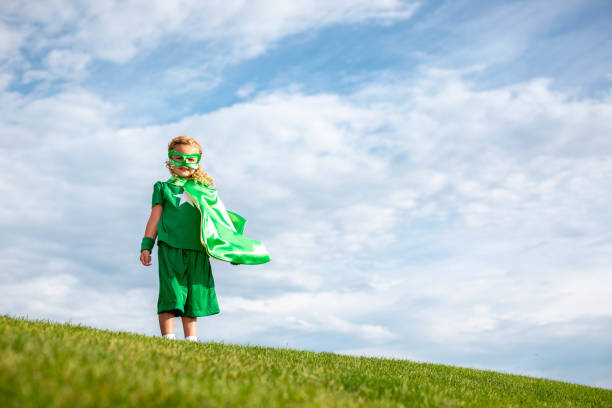 istock Little Girl Superhero 1556641567