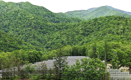 Rows of solar panels stand by the hillside at Utorokagawa in eastern Hokkaido Prefecture.