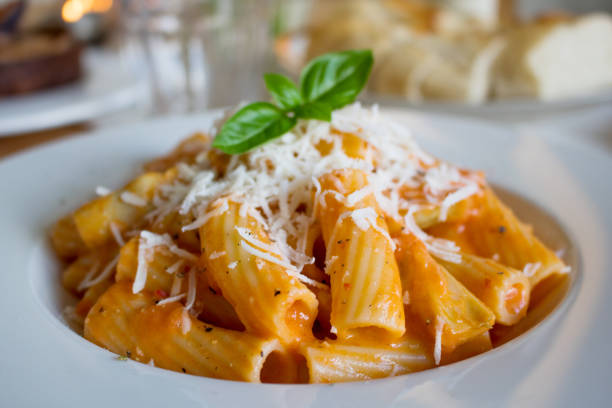 istock Pasta dish with a tomato and cream sauce with artichokes 1556661467