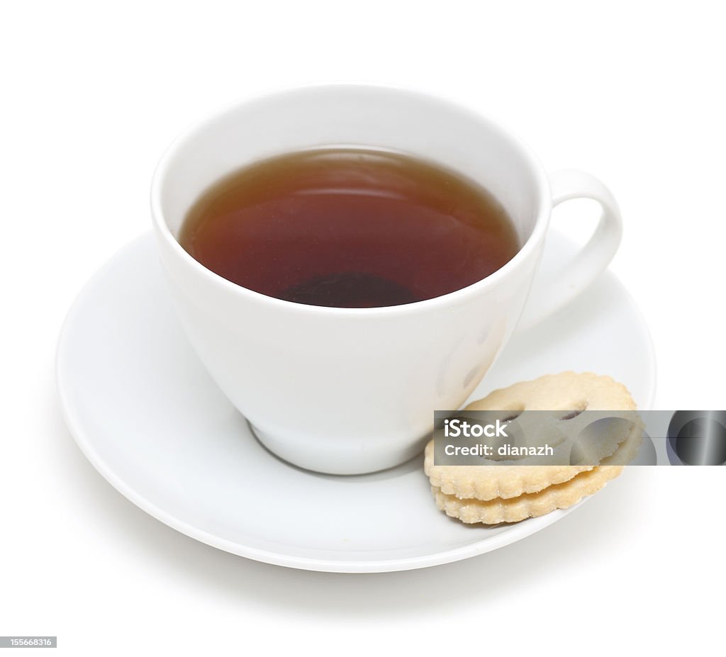 Tazza di tè e sorridente cookie - Foto stock royalty-free di Alimentazione non salutare