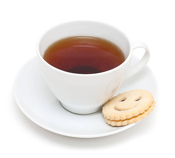 istock cup of tea and smiling cookie 155668316