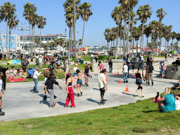 Venice, Los Angeles, California, USA -  July 2023- People skating and dancing at  the famous Venice Beach skate dance plaza.