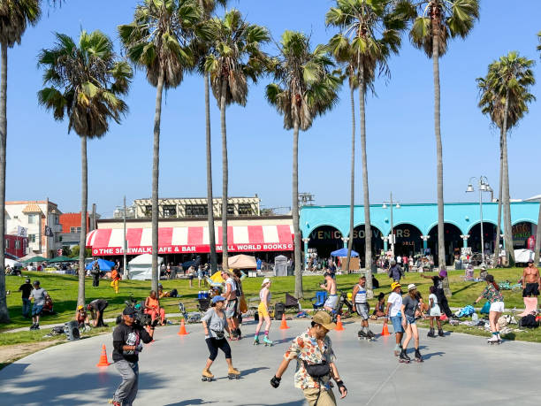 Venice, Los Angeles, California, USA -  July 2023- People skating and dancing at  the famous Venice Beach skate dance plaza.