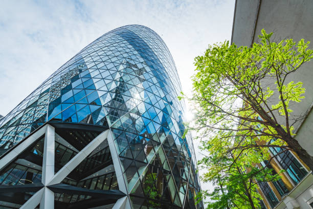 istock Low angle view of modern buildings against sky in London 1556710047