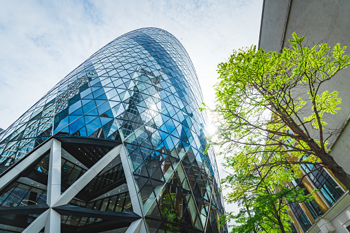 Low angle view of modern buildings against sky in London