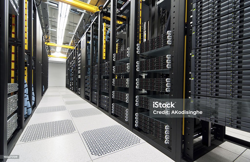 Server room with storage devices Rack mount servers, storage devices and network equipment shown. Business Stock Photo