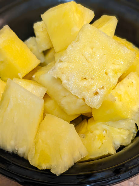 istock Chunks of Freshly Cut Organic Pineapple 1556730256