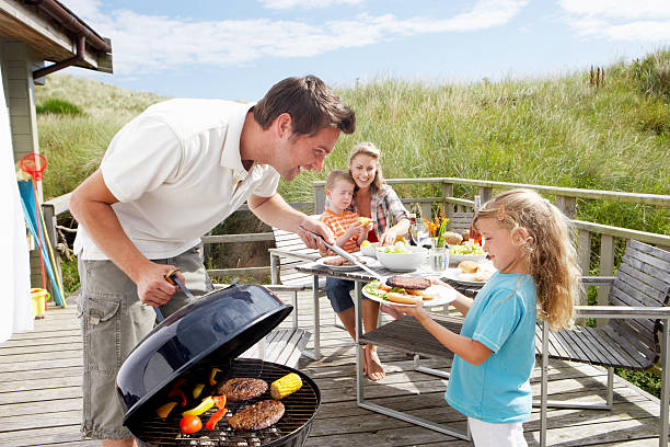 istock Family on vacation having barbecue 155674029