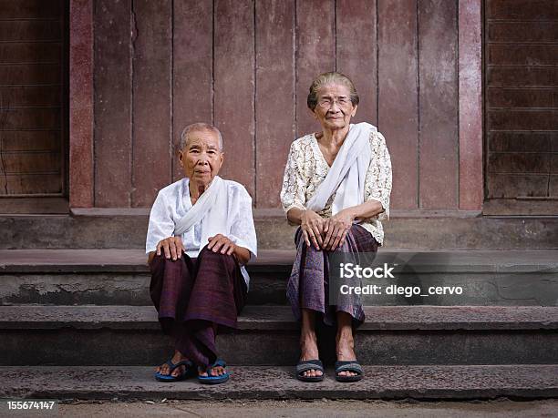 Portrait Of Two Senior Asian Women Looking At Camera Stock Photo - Download Image Now