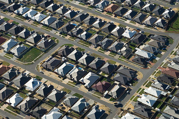 istock Aerial view of dense suburban housing. 155674324