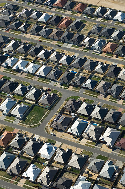 istock Aerial view of dense suburban housing. 155674334
