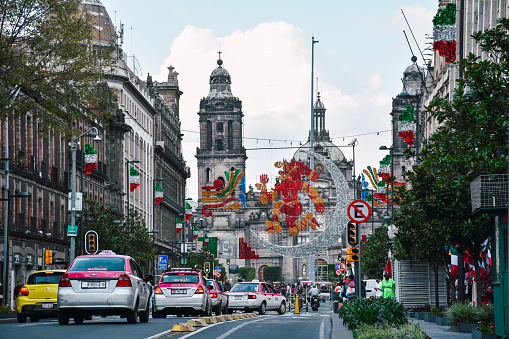 Zocalo square and metropolitan cathedral view from 20 de Noviembre Avenue, decorations at the zocalo in Mexico City for the 500 years of indigenous resistance
