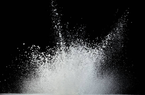 istock Tapioca starch flour fly explosion, White powder tapioca starch fall down in air. Seasoning flour powder is element material. Eyeshadow crush make up. Black background Isolated selective focus blur 1556838093