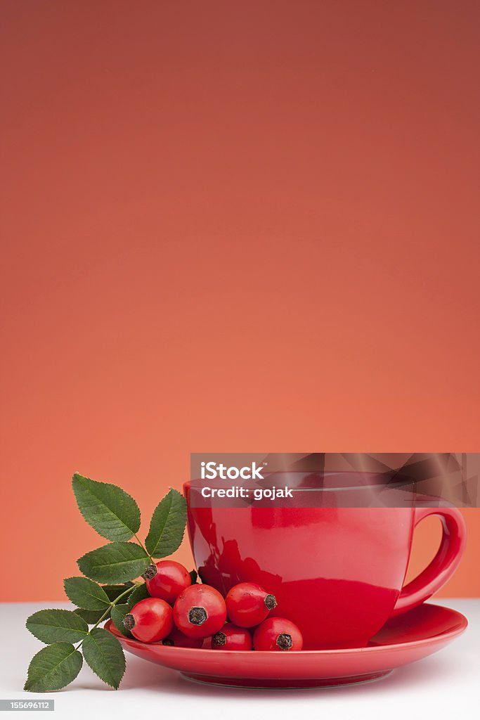 Rose Hip Tea Rose hip tea and fresh rose hips Alternative Medicine Stock Photo