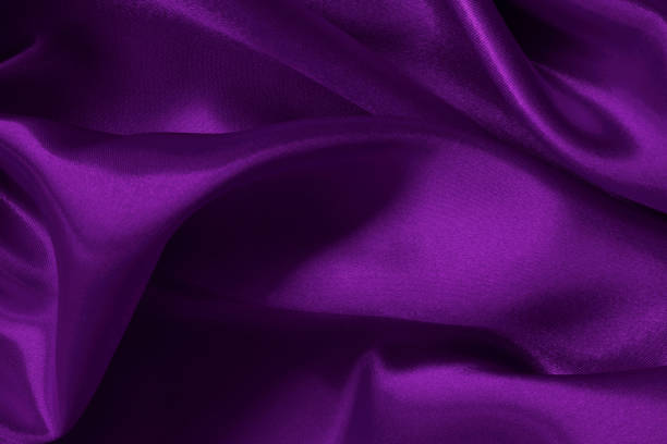 istock Purple fabric cloth texture for background and design art work, beautiful crumpled pattern of silk or linen. 1556982781