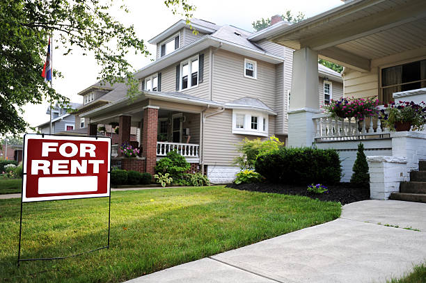 A beautiful home available for rent Home For Rent Sign in Front of Beautiful American Home  house rental stock pictures, royalty-free photos & images