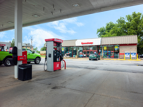 Whitesboro, New York - July 2, 2023: Close-up View of Speedway Gas Pump in the Foreground and the Speedway Convenience Store in the Background II.