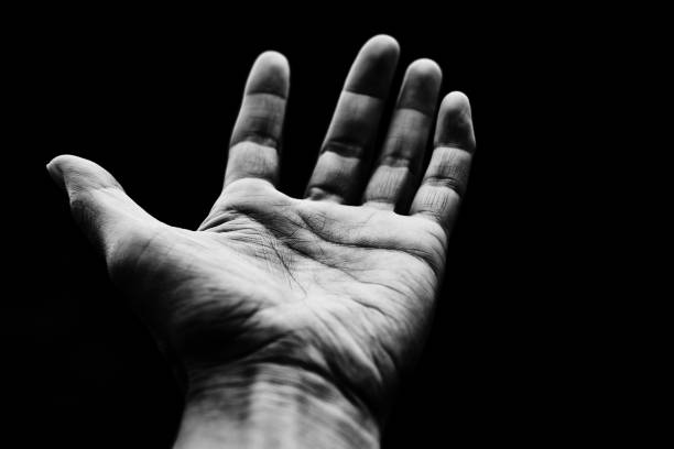istock Image of reaching out in the dark 1557034628