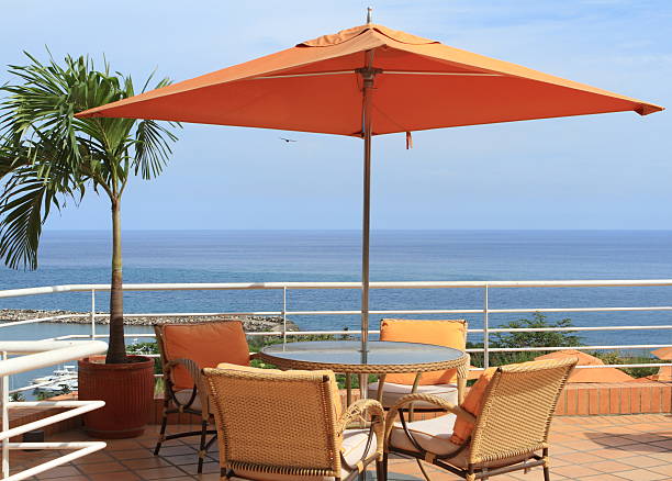 istock Table, chairs and umbrella by sea 155705399