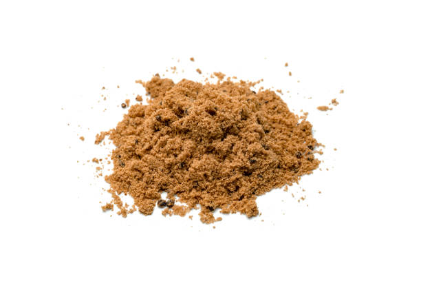 istock Brown cane sugar pile isolated on white background 1557114855