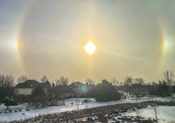 Cold Day Sundog Sundog Phenomenon in a cold Midwest morning. sundog stock pictures, royalty-free photos & images