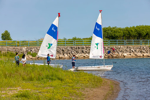 Manitowoc WI USA July 18 2023: Sailing course for beginners. The instructor gives instructions to the course participant.