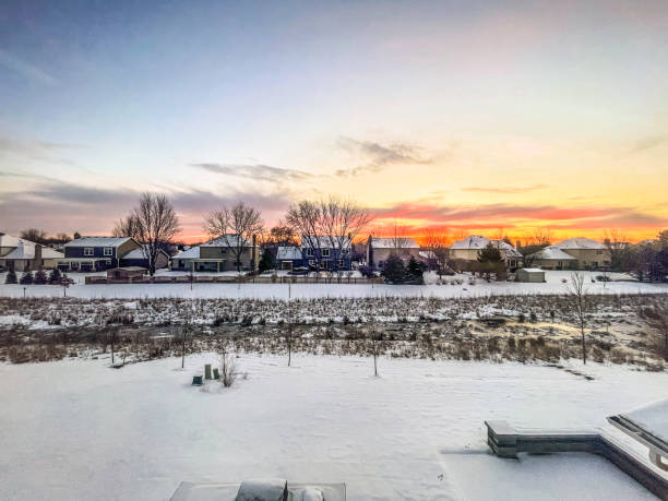 Snow covering Midwest neighborhood at sunrise