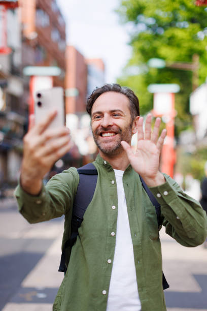 istock Caucasian man taking selfie with mobile phone 1557208007