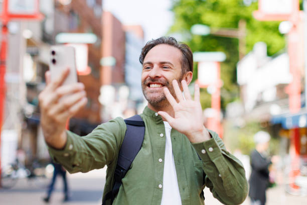 istock Caucasian man taking selfie with mobile phone 1557208012