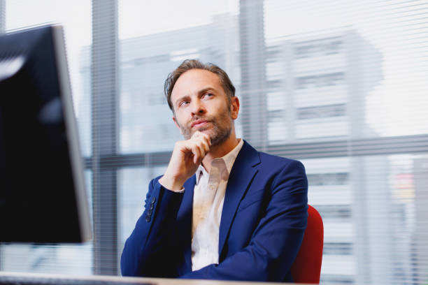 istock Caucasian man at work contemplating 1557235876