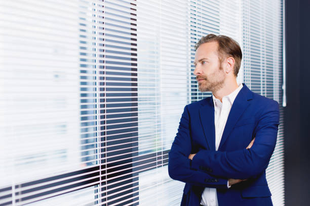 Free Stock Photo of Man in Suit and Tie Standing in Front of Window ...